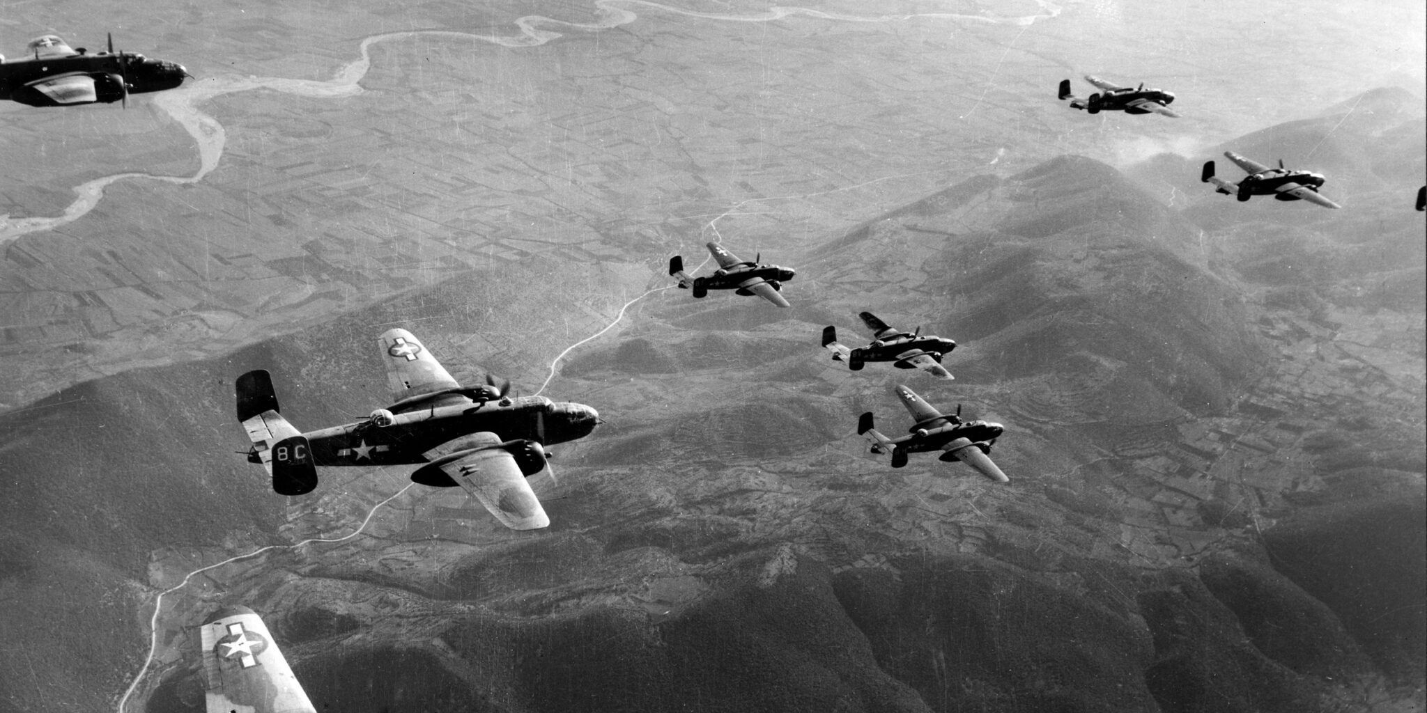 Aircrew silhouetted against the sky