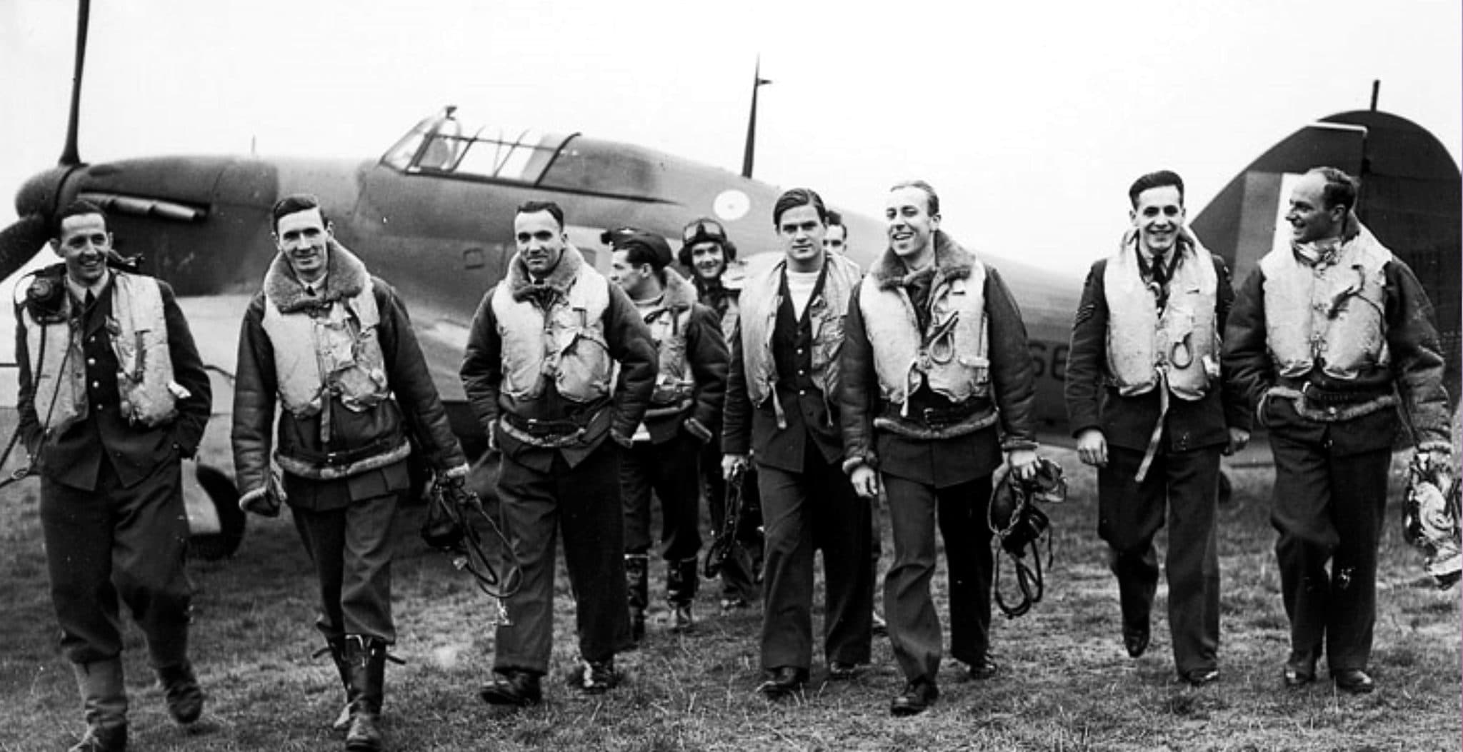 Aircrew with a parachute canopy, smiling